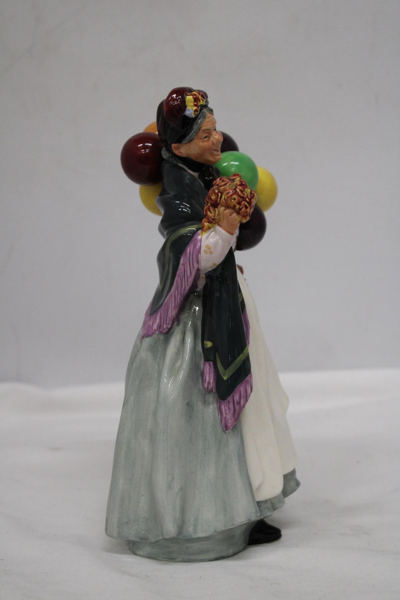 A ROYAL DOULTON FIGURE " BIDDY PENNY FARTHING" HN 1843 - Image 5 of 6