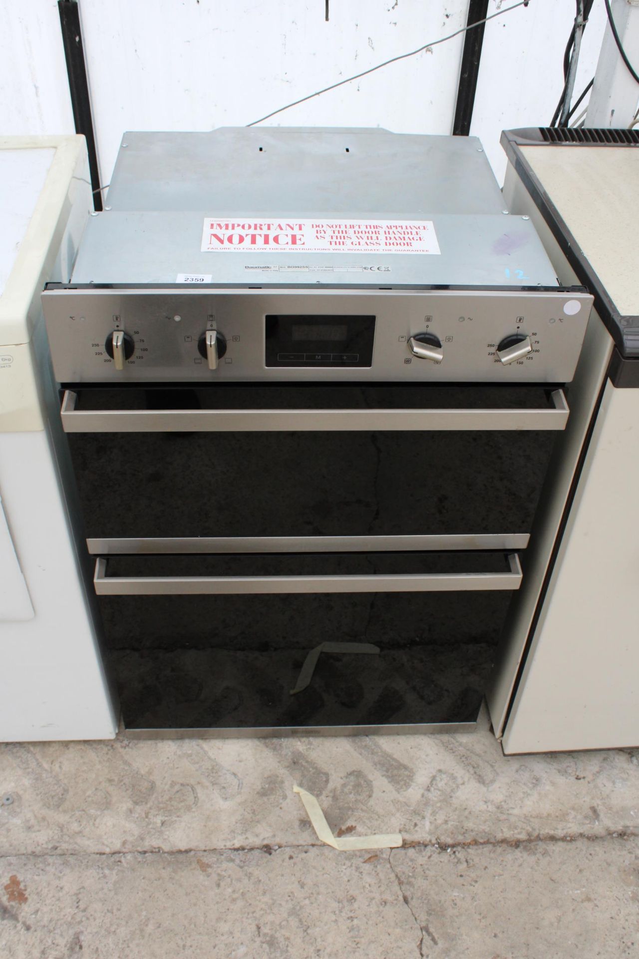 A CHROME AND BLACK BAUMATIC INTERGRATED DOUBLE OVEN