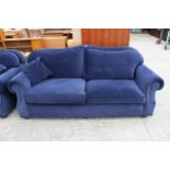 A MODERN BLUE THREE SEATER SETTEE WITH SPRUNG EDGE