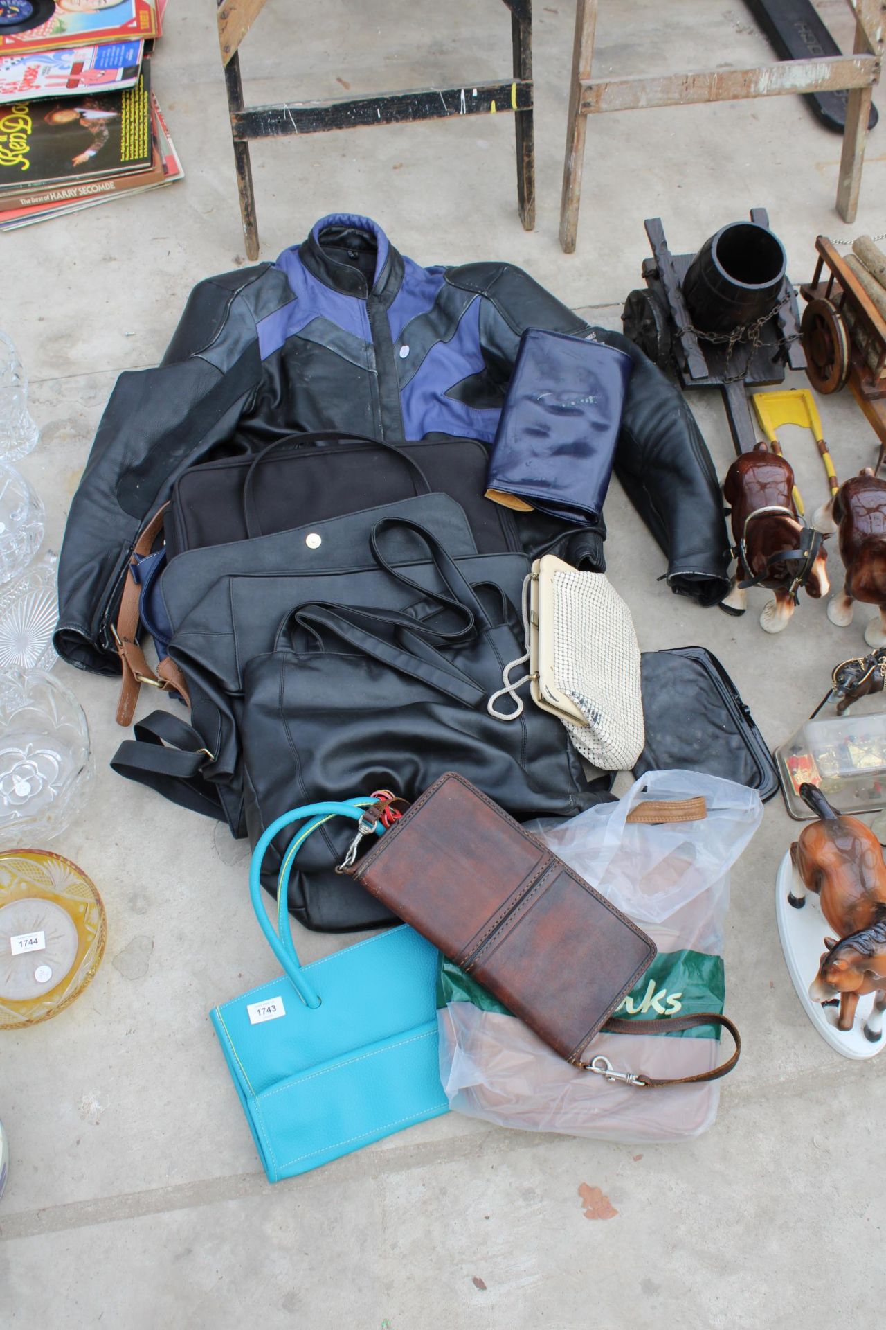 A MOTORBIKE JACKET AND AN ASSORTMENT OF LADIES HANDBAGS