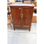 A CHINESE ELM TAPERING TWO DOOR CABINET WITH BRASS HANDLES AND LOCK WITH TWO INTERNAL DRAWERS, 36"