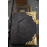 TWO LARGE LEATHER BOUND ANTIQUARIAN BIBLES, ONE WELSH, WITH BRASS CLASPS