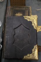 TWO LARGE LEATHER BOUND ANTIQUARIAN BIBLES, ONE WELSH, WITH BRASS CLASPS