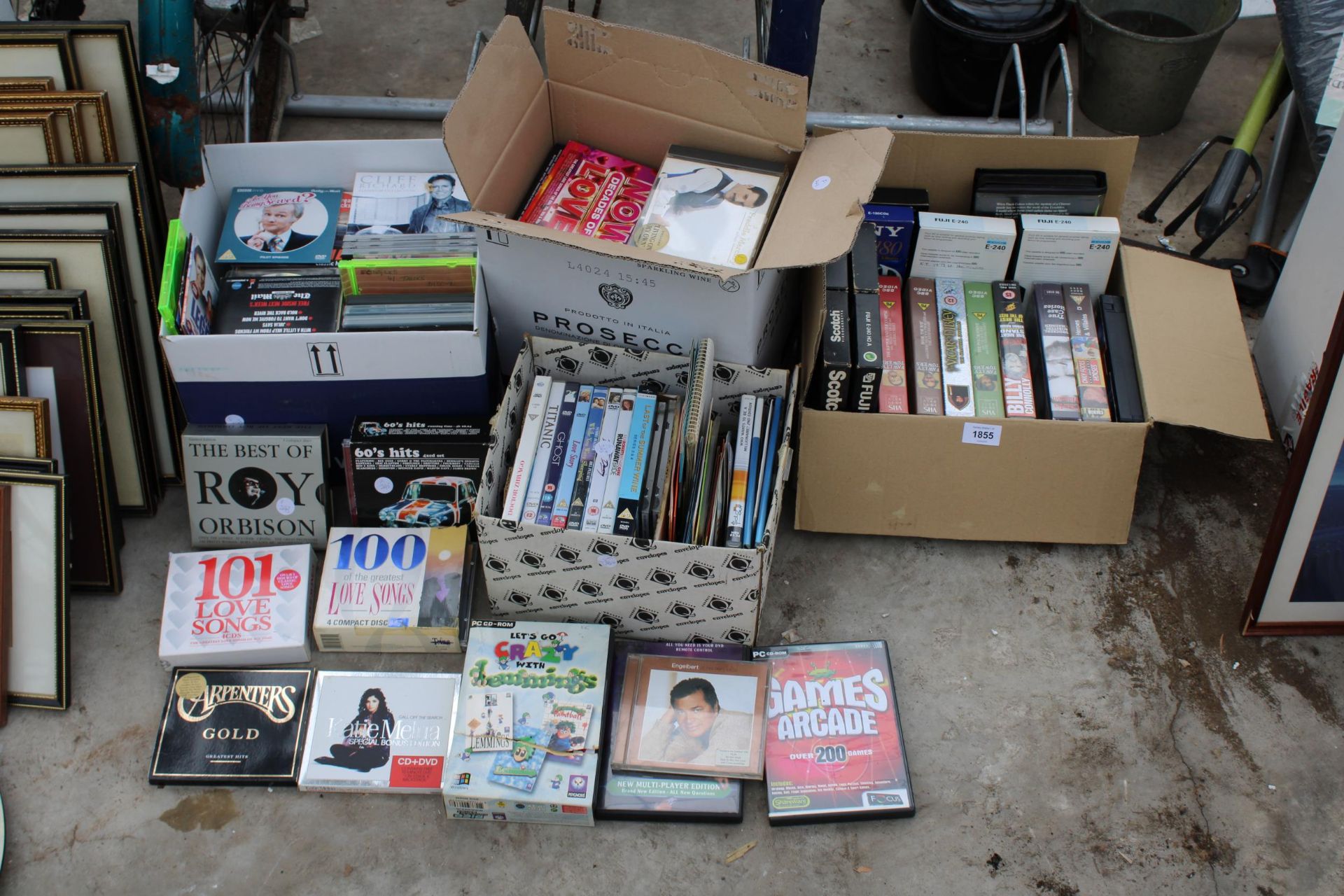 AN ASSORTMENT OF CDS, DVDS AND VHS VIDEOS