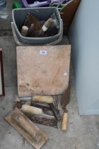 AN ASSORTMENT OF PLASTERING TOOLS TO INCLUDE TROWELS ETC
