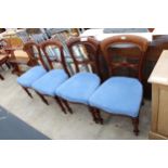 A SET OF FOUR VICTORIAN MAHOGANY DINING CHAIRS ON TURNED FRONT LEGS