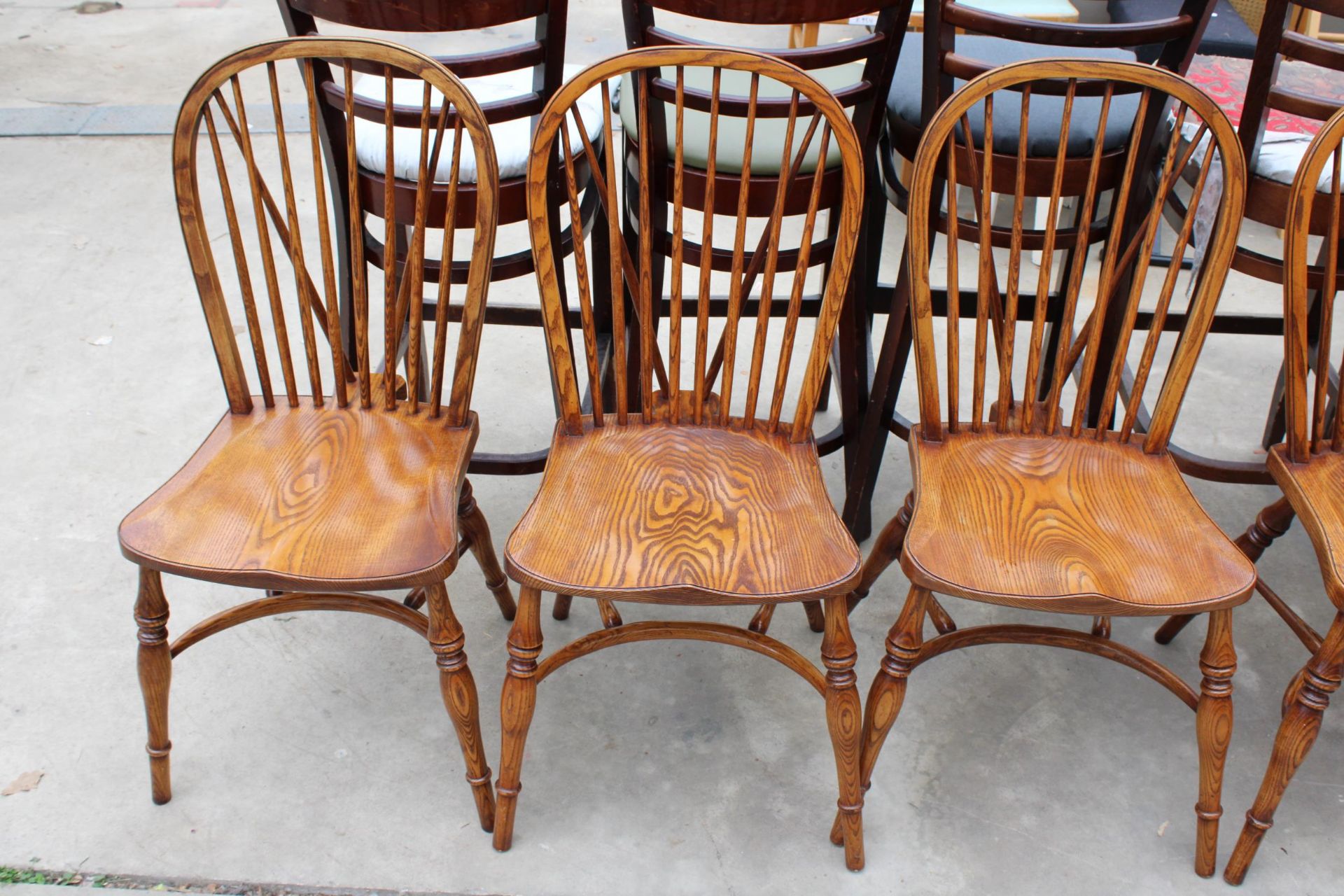 A SET OF EIGHT ELM R.W.F.CO WINDSOR STYLE DINING CHAIRS WITH STICK BACKS AND CRINOLINE BOWS - Image 2 of 9