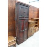A 19TH CENTURY STAINED PINE FULL LENGTH FOUR DOOR CORNER CUPBOARD 32" WIDE