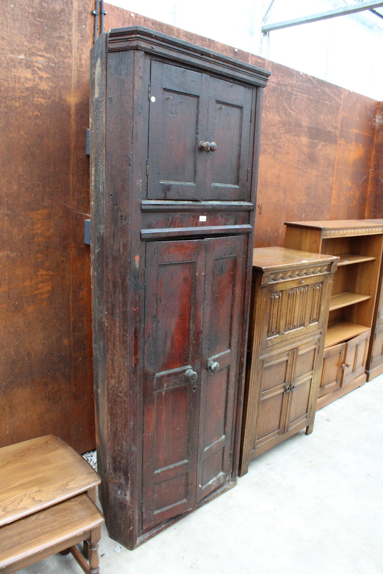 A 19TH CENTURY STAINED PINE FULL LENGTH FOUR DOOR CORNER CUPBOARD 32" WIDE