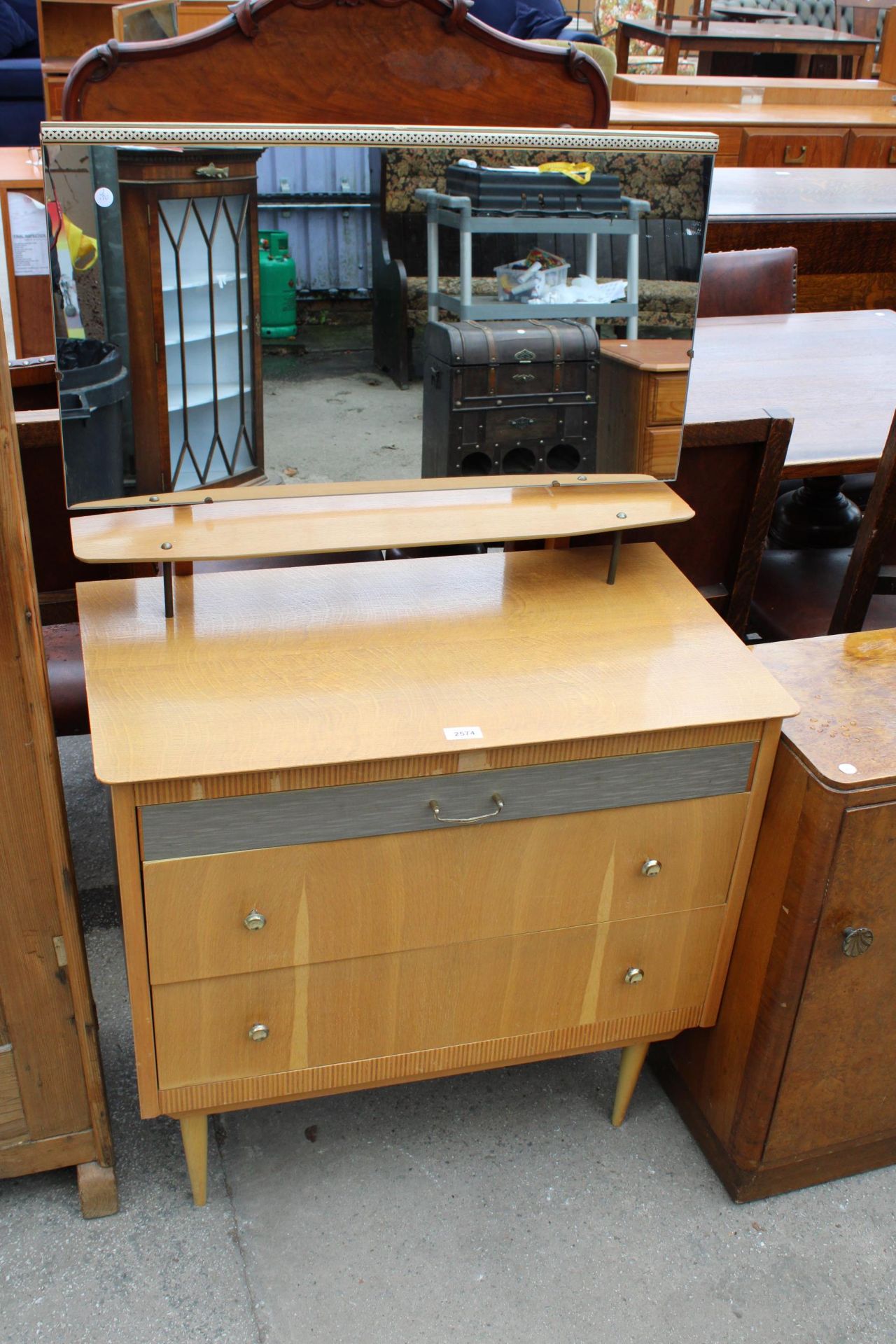 A RETRO OAK DRESSING CHEST ENCLOSING THREE DRAWERS, ONE BEING SILVER COLOURED, 30" WIDE