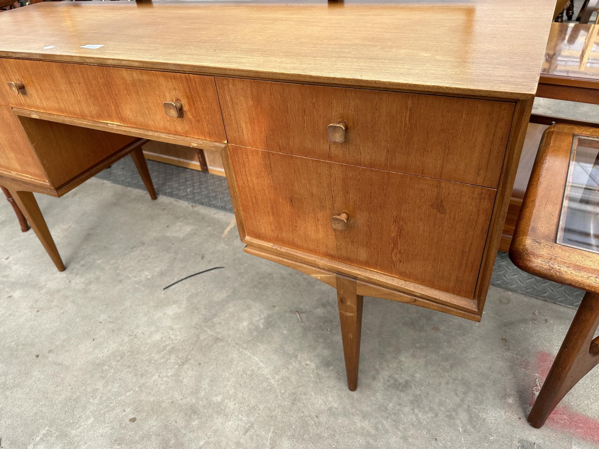 A MCINTOSH RETRO TEAK DRESSING TABLE ENCLOSING FIVE DRAWERS, 55.5" WIDE ON TAPERING LEGS - Image 4 of 5