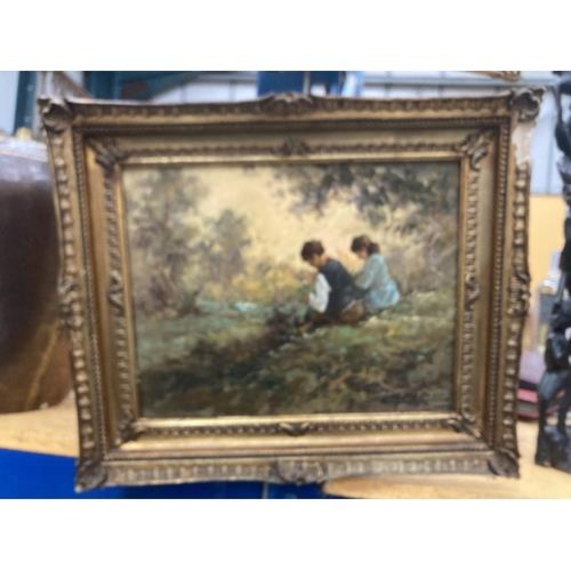 A GILT FRAMED OIL ON BOARD OF TWO CHILDREN BY A RIVER SIGNED 29.5CM X 23CM