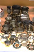 A LARGE QUANTITY OF BRASSWARE TO INCLUDE PLANTERS, SMALL KETTLES, BOWLS, VASES, ETC