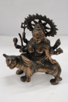 A BRONZE EXOTIC INDIAN MOTHER GODDESS ON A TIGER'S BACK, HEIGHT 38CM, LENGTH 28CM