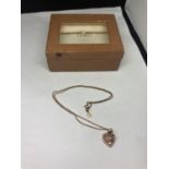 A CLOGAU 9 CARAT GOLD HEART PENDANT IN ORIGINAL PRESENTATION BOX WITH CERTIFICATE OF AUTHENTICITY