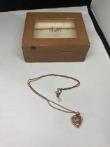 A CLOGAU 9 CARAT GOLD HEART PENDANT IN ORIGINAL PRESENTATION BOX WITH CERTIFICATE OF AUTHENTICITY