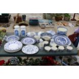 A LARGE ASSORTMENT OF BLUE AND WHITE CERAMIC ITEMS TO INCLUDE MEAT PLATTERS, CUPS AND PLATES ETC