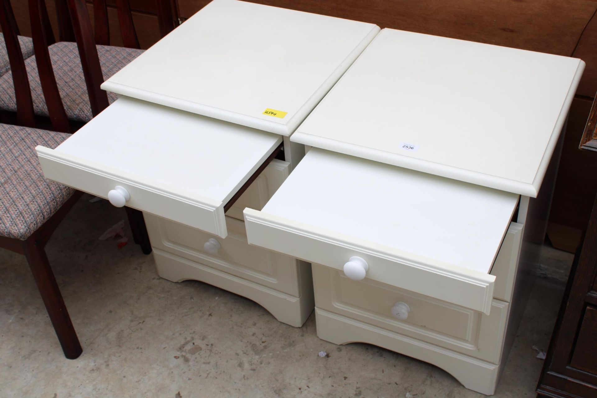 A PAIR OF CREAM BEDSIDE CHESTS OF THREE DRAWERS - Image 2 of 2