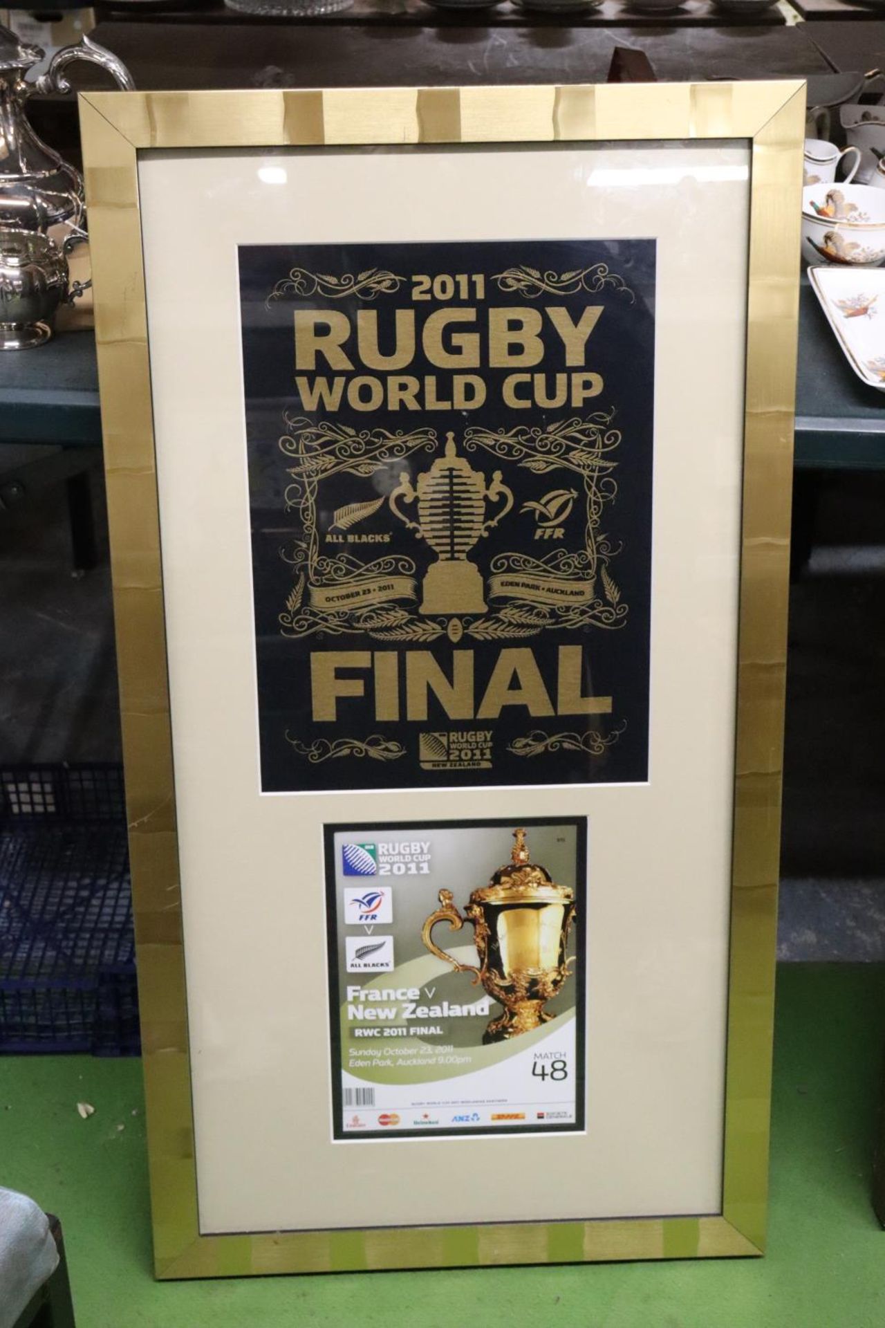 A FRAMED AND GLAZED MONTAGE FROM AUCKLAND, NEW ZEALAND, THE 2011 RUGBY WORLD CUP FINAL, NEW