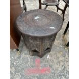 AN INDIAN HARDWOOD 15" DIAMETER TABLE INLAID WITH BRASS