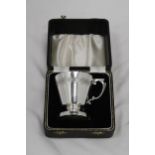 A VINTAGE SILVER PLATED CHRISTENING CUP IN THE ORIGINAL PRESENTATION BOX