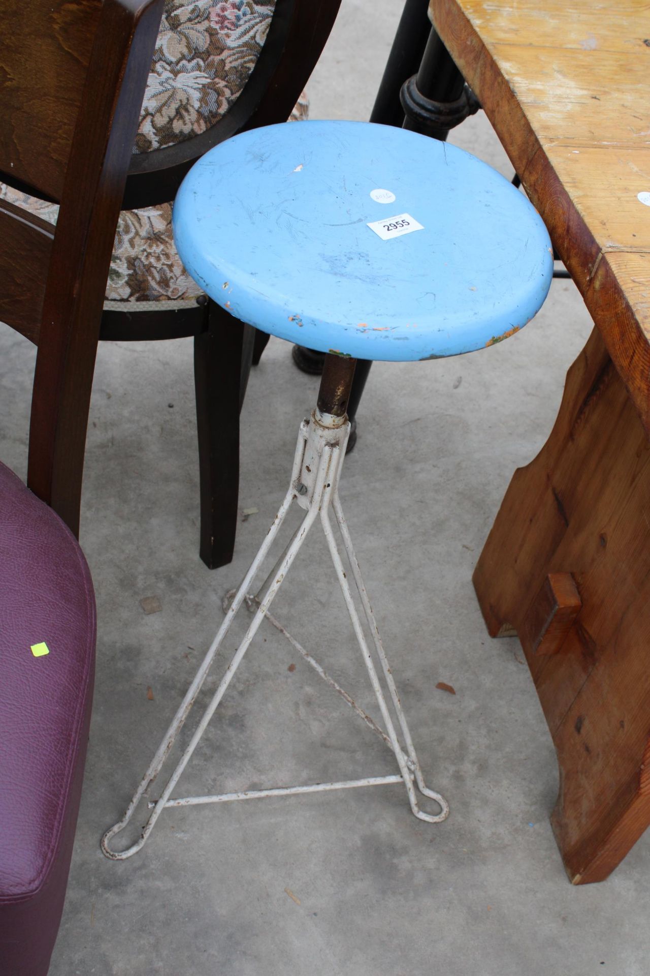 A MID 20TH CENTURY 11" DIAMETER BEECH STOOL ON IRON FRAME