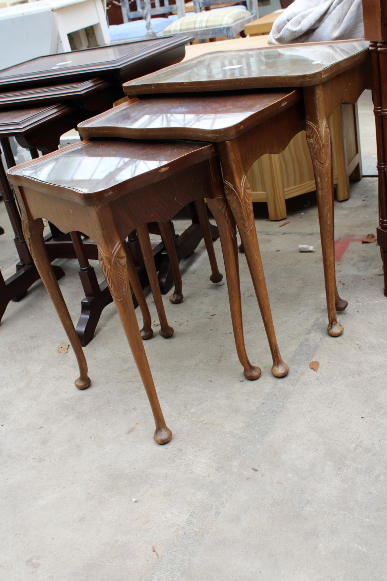 A WALNUT NEST OF THREE TABLES ON CABRIOLE LEGS - Image 2 of 2