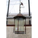 A DECORATIVE VINTAGE COPPER AND GLASS CEILING LIGHT FITTING