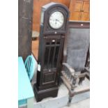 AN EARLY 20TH CENTURY HALL CLOCK WITH WESTMINSTER CHIME, KEYS AND PENDULUM