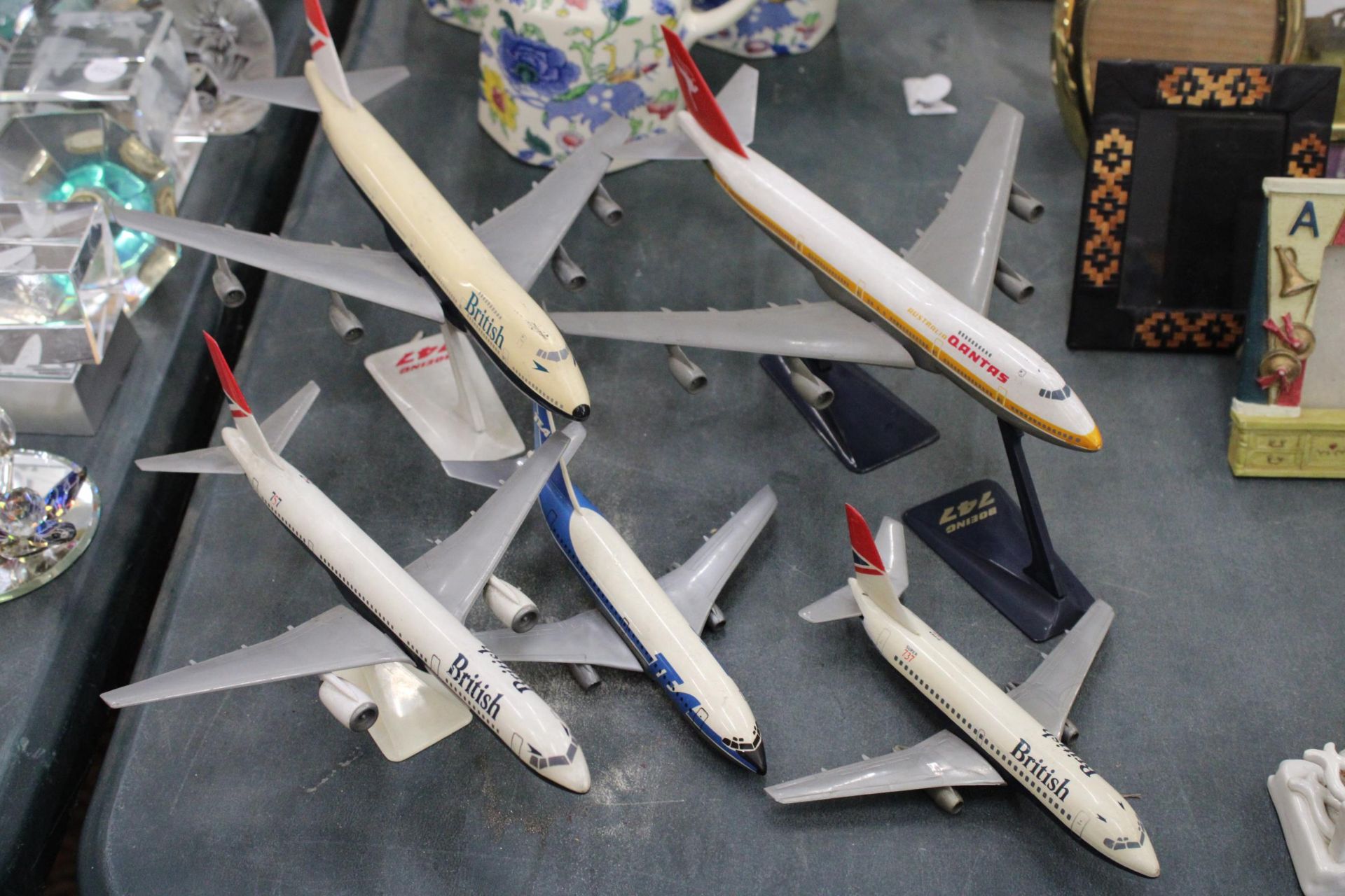 FIVE VINTAGE MODELS OF PLANES, FOUR ON PLINTHS, TO INCLUDE BRITISH AIRWAYS AND QANTAS