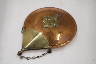 A VINTAGE COPPER POWDER FLASK WITH A COAT OF ARMS