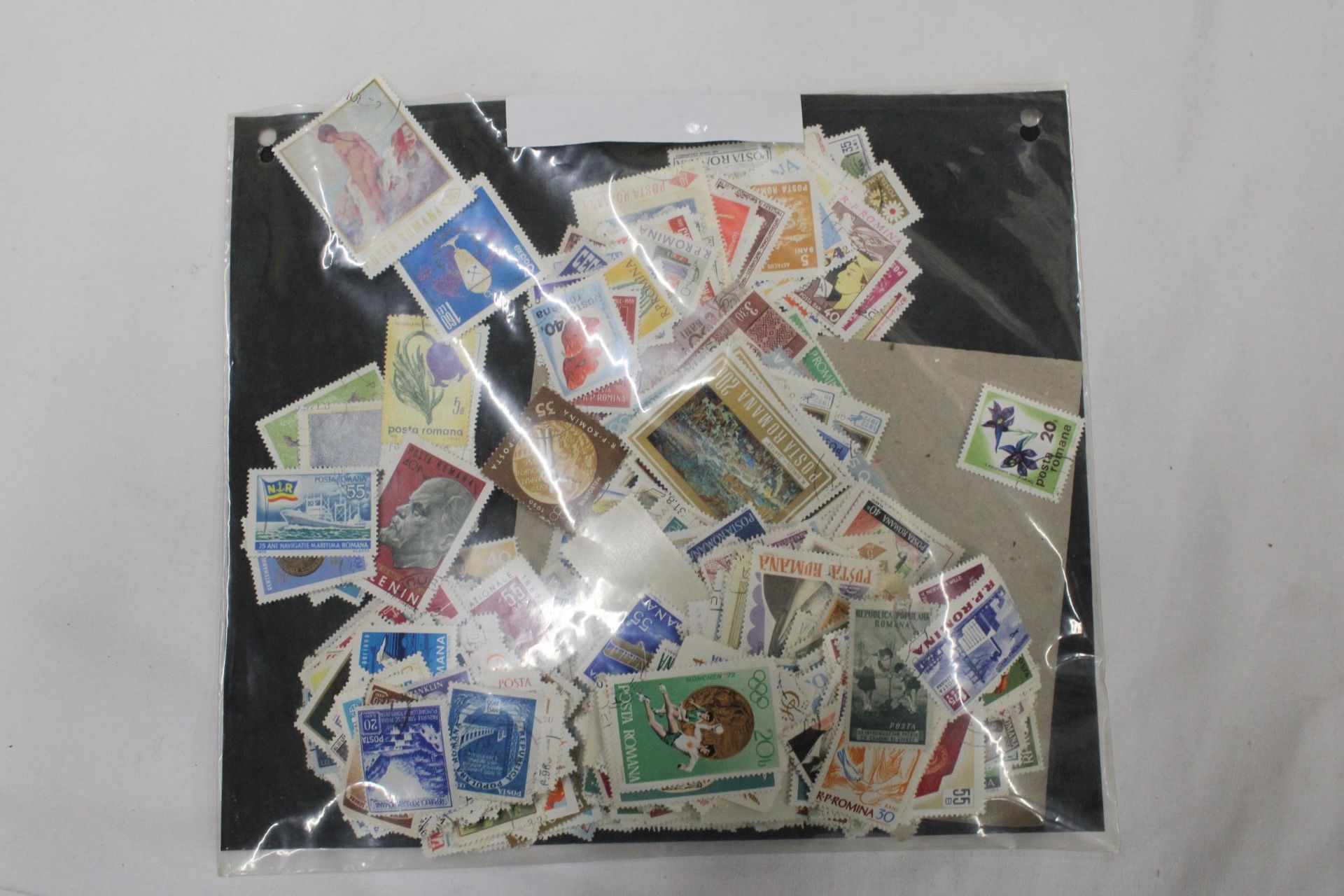 A QUANTITY OF LOOSE STAMPS FROM AROUND THE WORLD