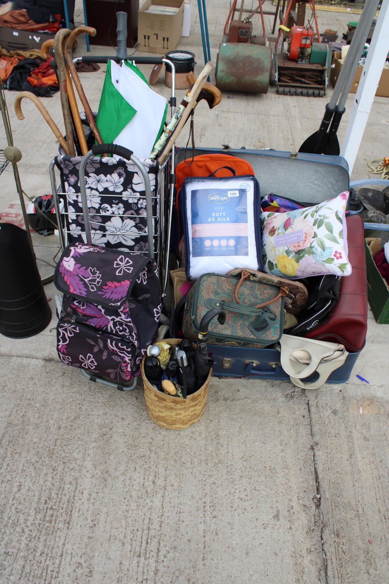 A LARGE ASSORTMENT OF ITEMS TO INCLUDE WALKING STICKS, BEDDING AND BAGS ETC