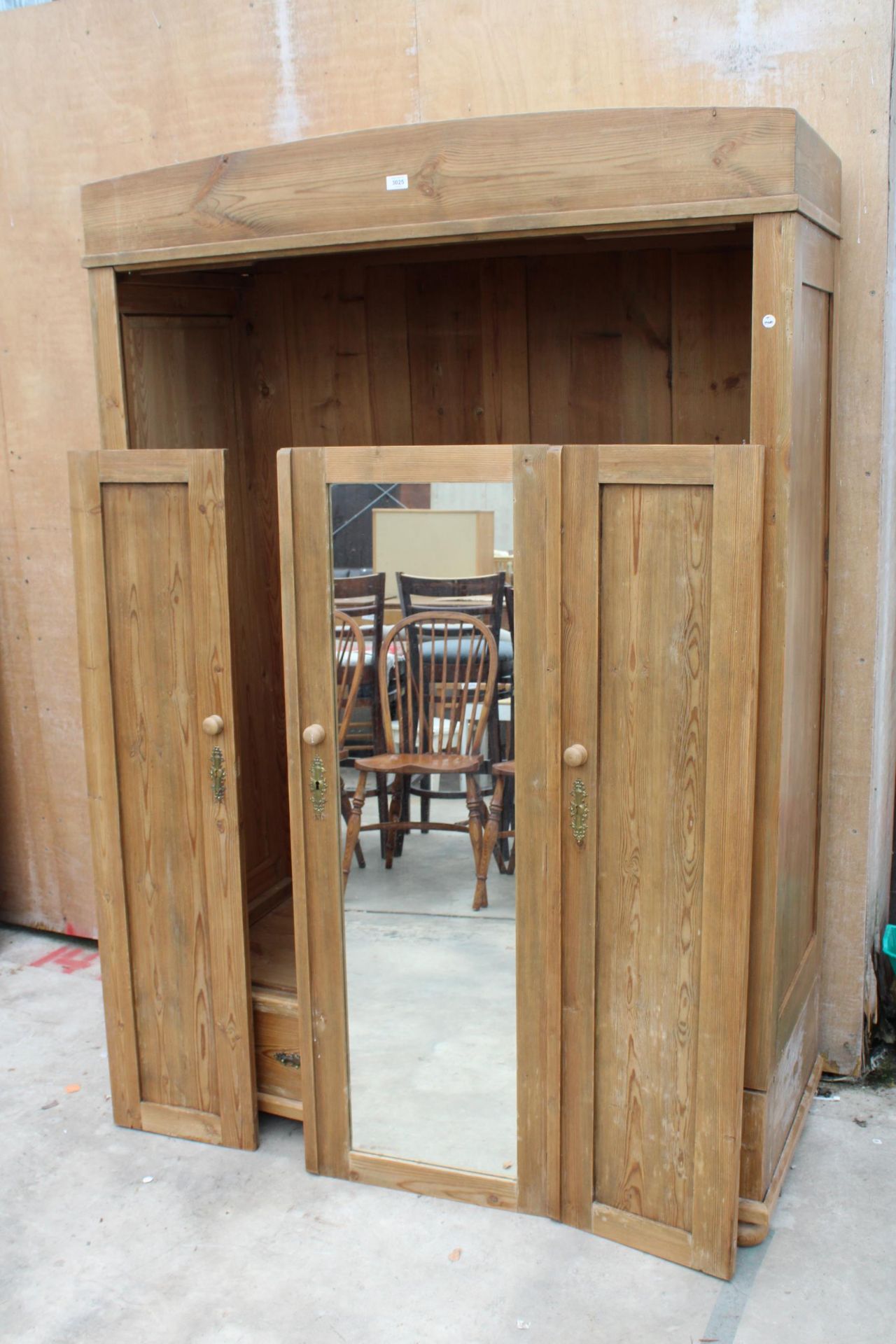 A PINE CONTINENTAL STYLE MIRROR DOOR WARDROBE WITH TWO DRAWERS TO BASE, 51" WIDE