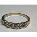 A 9 CARAT GOLD RING WITH CUBIC ZIRCONIAS SIZE S