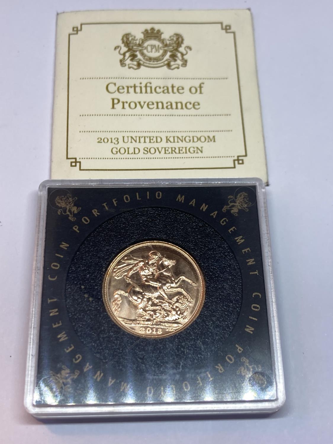 A 2013 GOLD SOVEREIGN WITH CERTIFICATE OF AUTHENTICITY