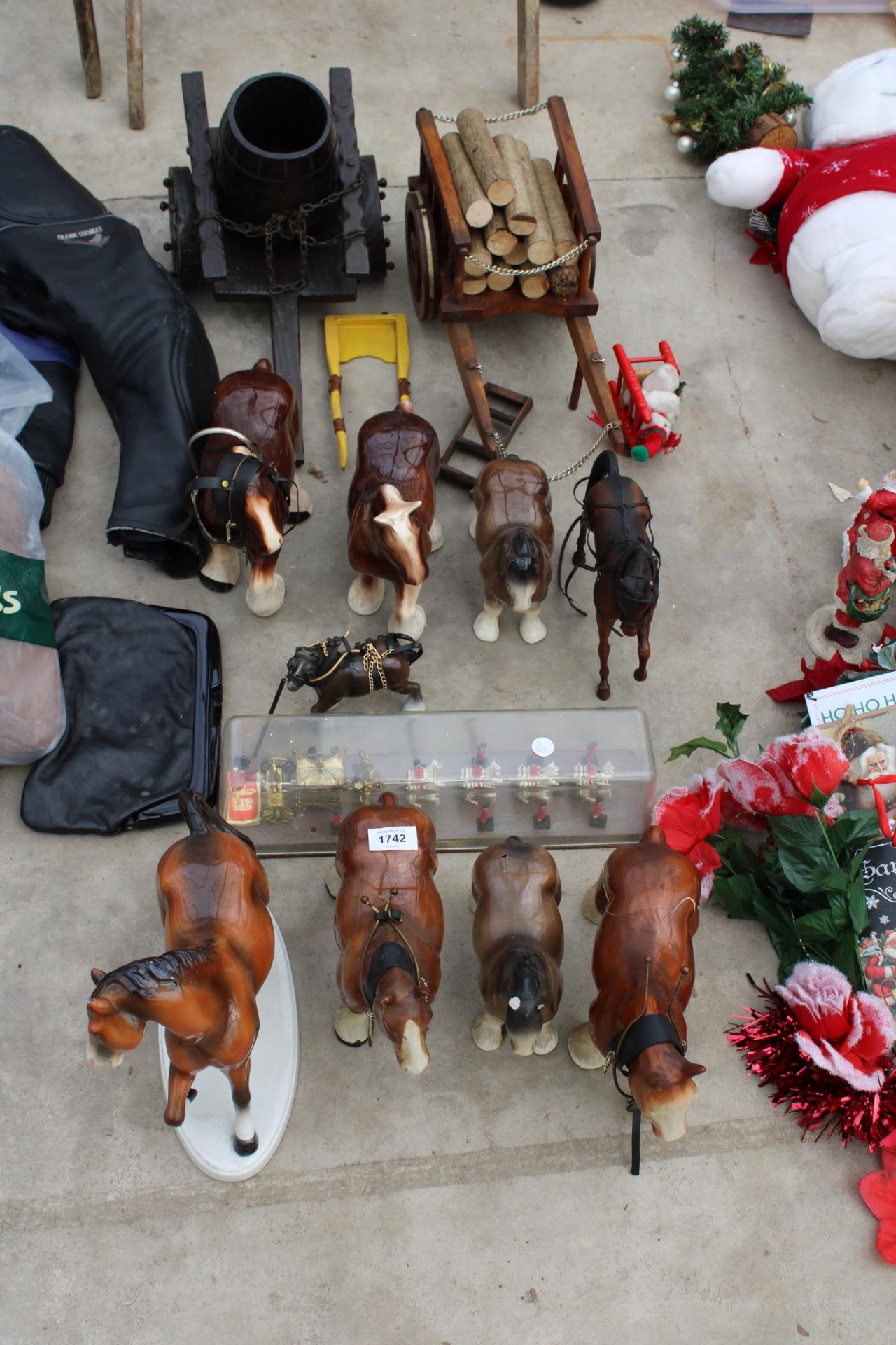 AN ASSORTMENT OF CERAMIC MODEL HORSES TO INCLUDE TWO CARTS