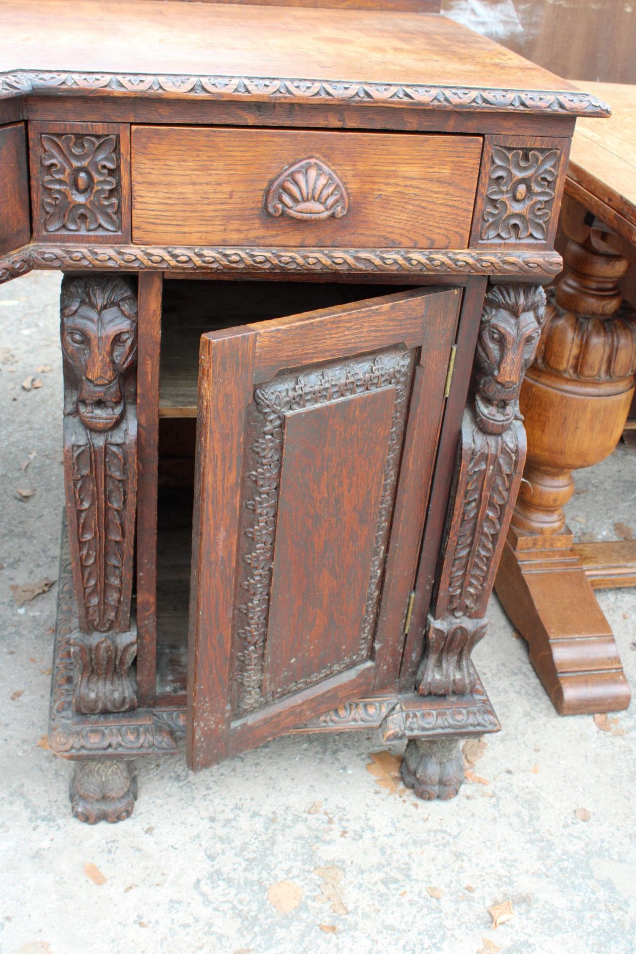 A VICTORIAN OAK BREAKFRONT SIDEBOARD ON CARVED CLAW FEET WITH CARVED PANELS WITH MYTHICAL - Image 2 of 4