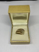 A SILVER GILT RING