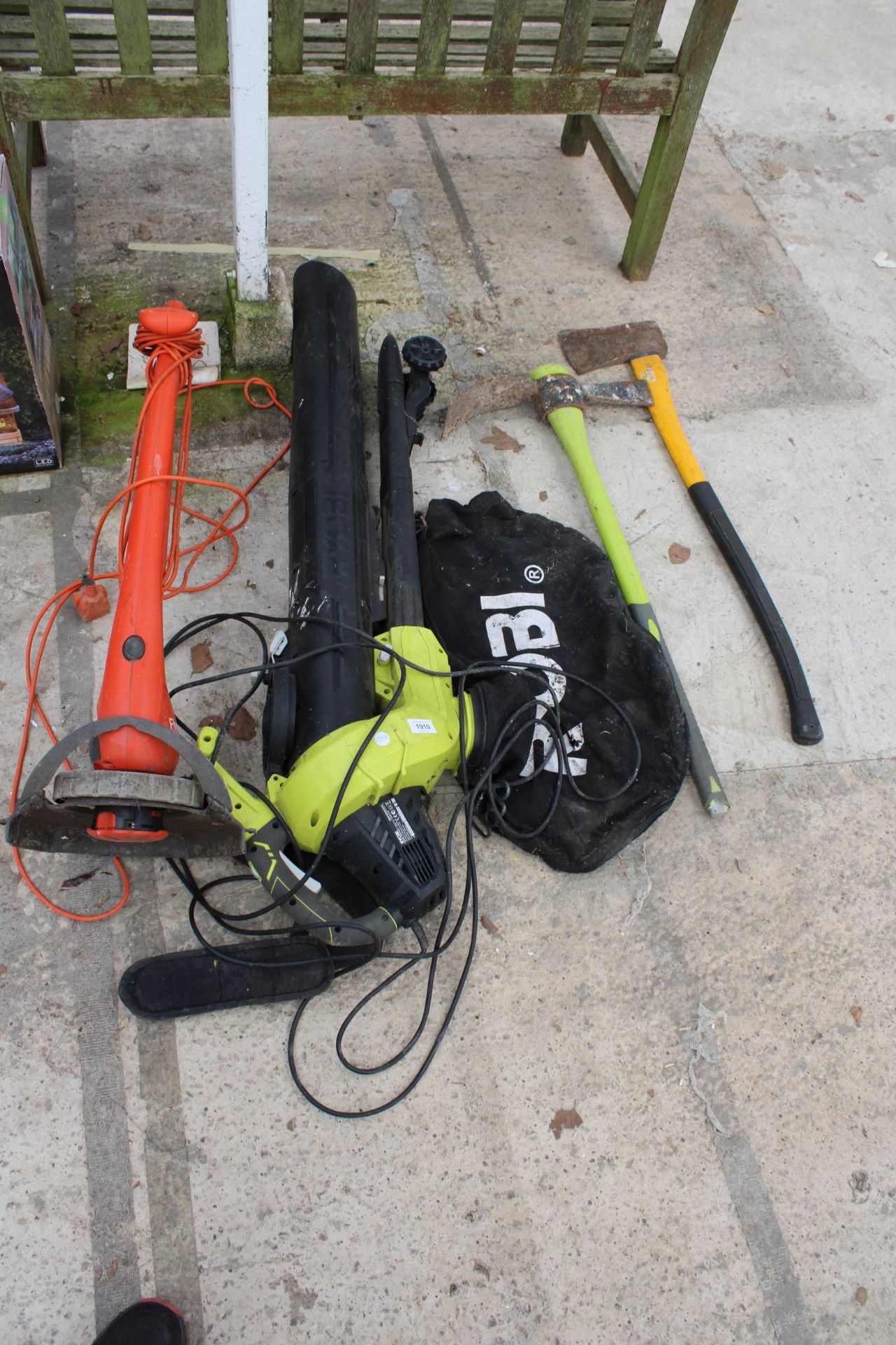 AN ELECTRIC FLYMO STRIMMER, A RYOBI LEAF VAC, A PICK AXE AND AN AXE