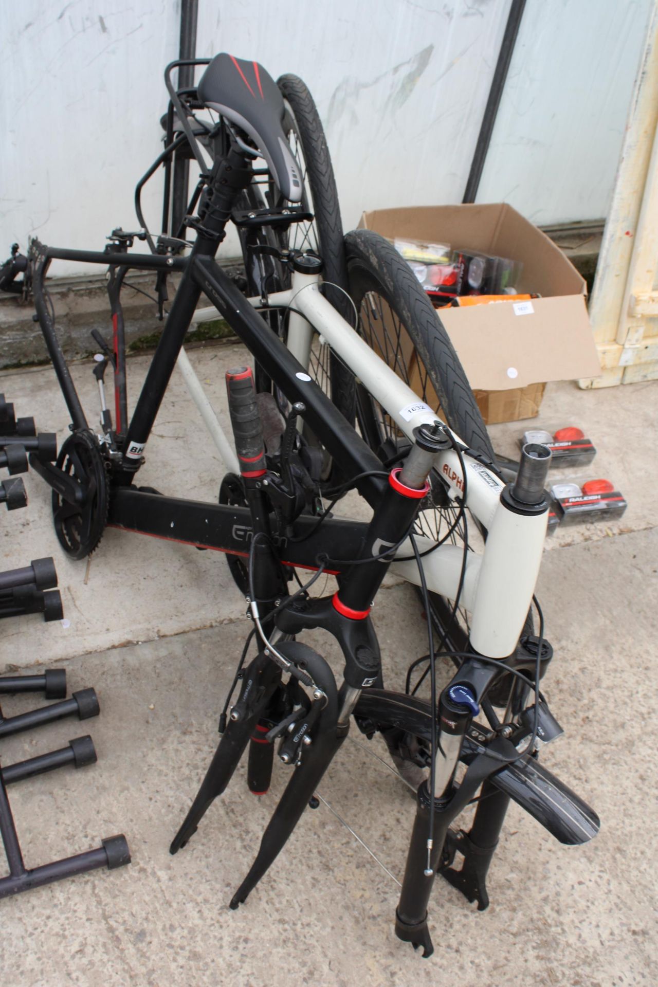 TWO BIKE FRAMES TO INCLUDE AN ALPHA, TWO WHEELS AND TYRES AND A SET OF HANDLE BARS ETC