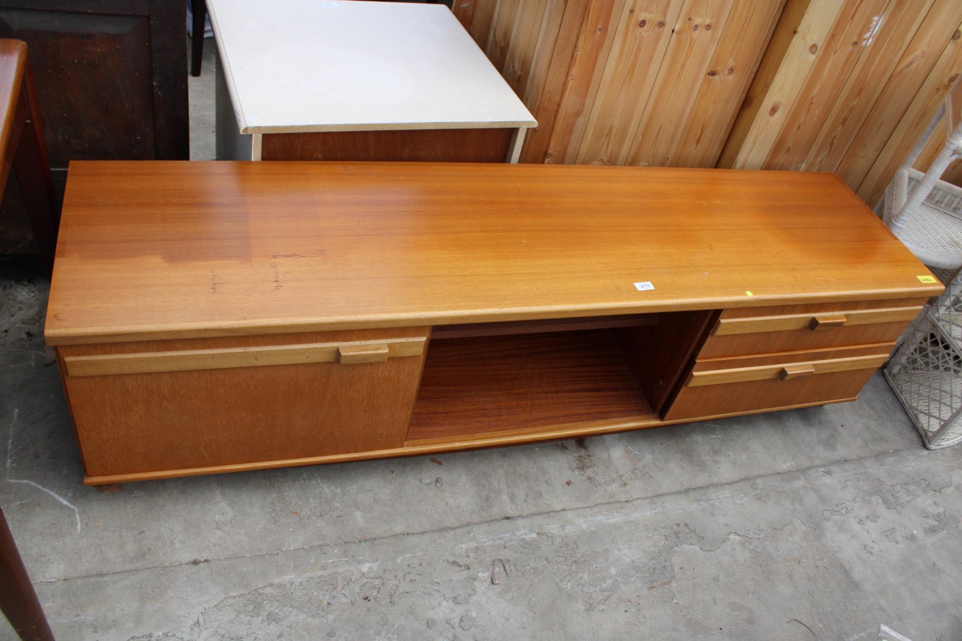 A RETRO TEAK PORTWOOD FURNITURE LOW UNIT ENCLOSING CUPBOARD AND DRAWERS, 72" WIDE