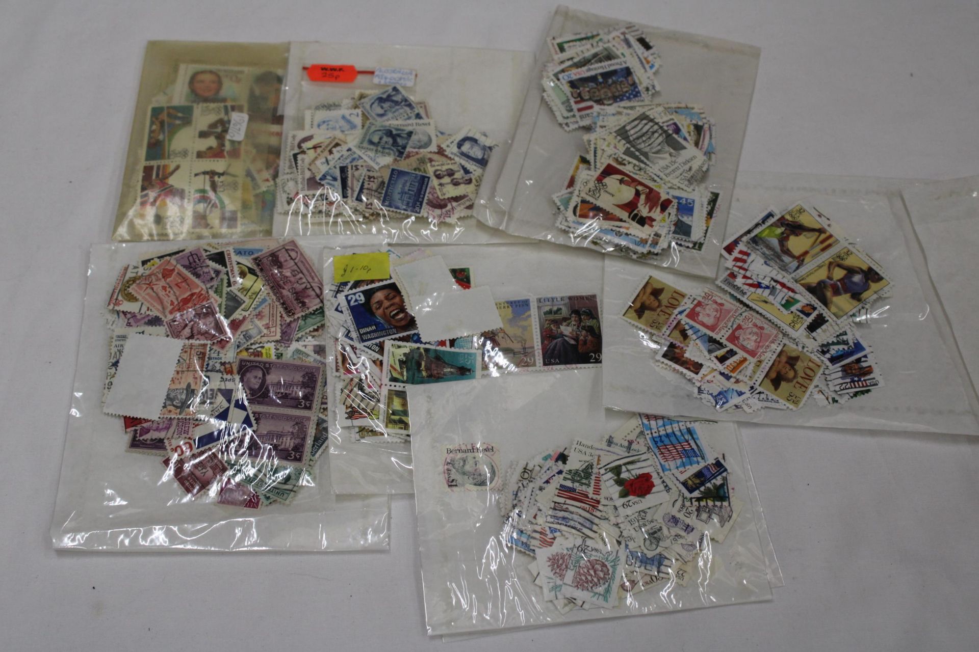 A QUANTITY OF STAMPS FROM THE USA IN PACKETS