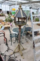 A WOODEN BIRDTABLE WITH SLATE EFFECT ROOF