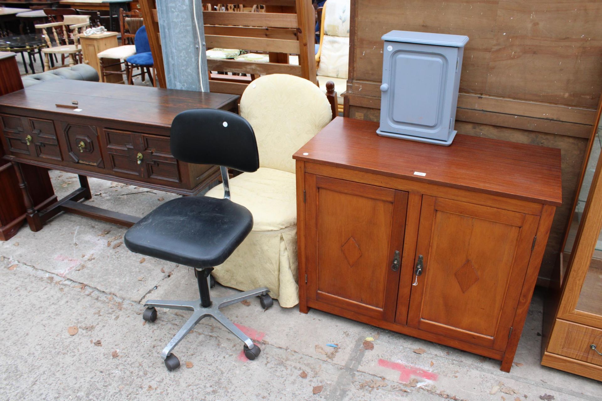 A SMALL PAINTED WALL CABINET, BEDROOM CHAIR, SWIVEL OFFICE CHAIR AND A TEAK TWO DOOR CABINET