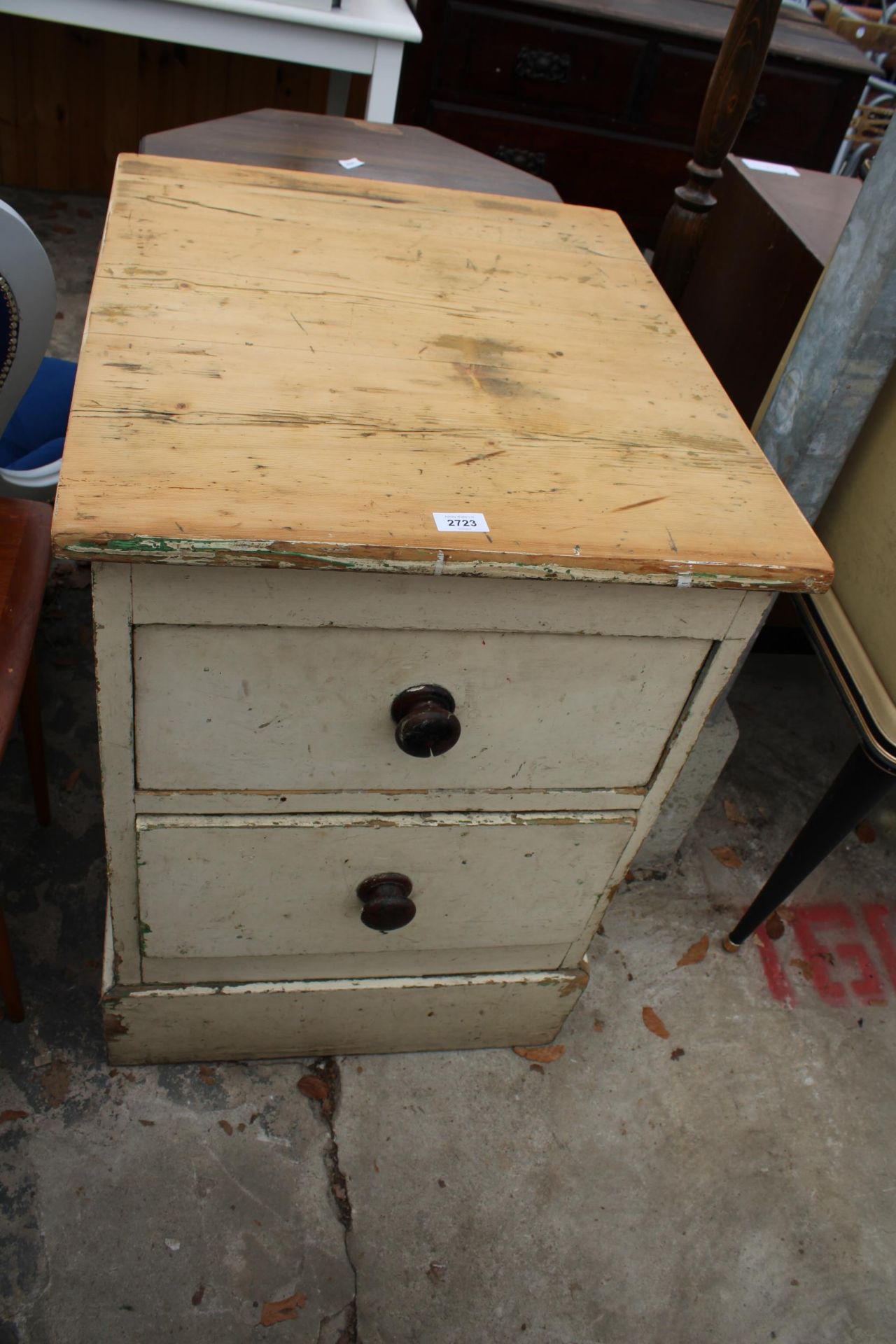 A SMALL VICTORIAN PINE CHEST OF TWO DRAWERS 23" WIDE