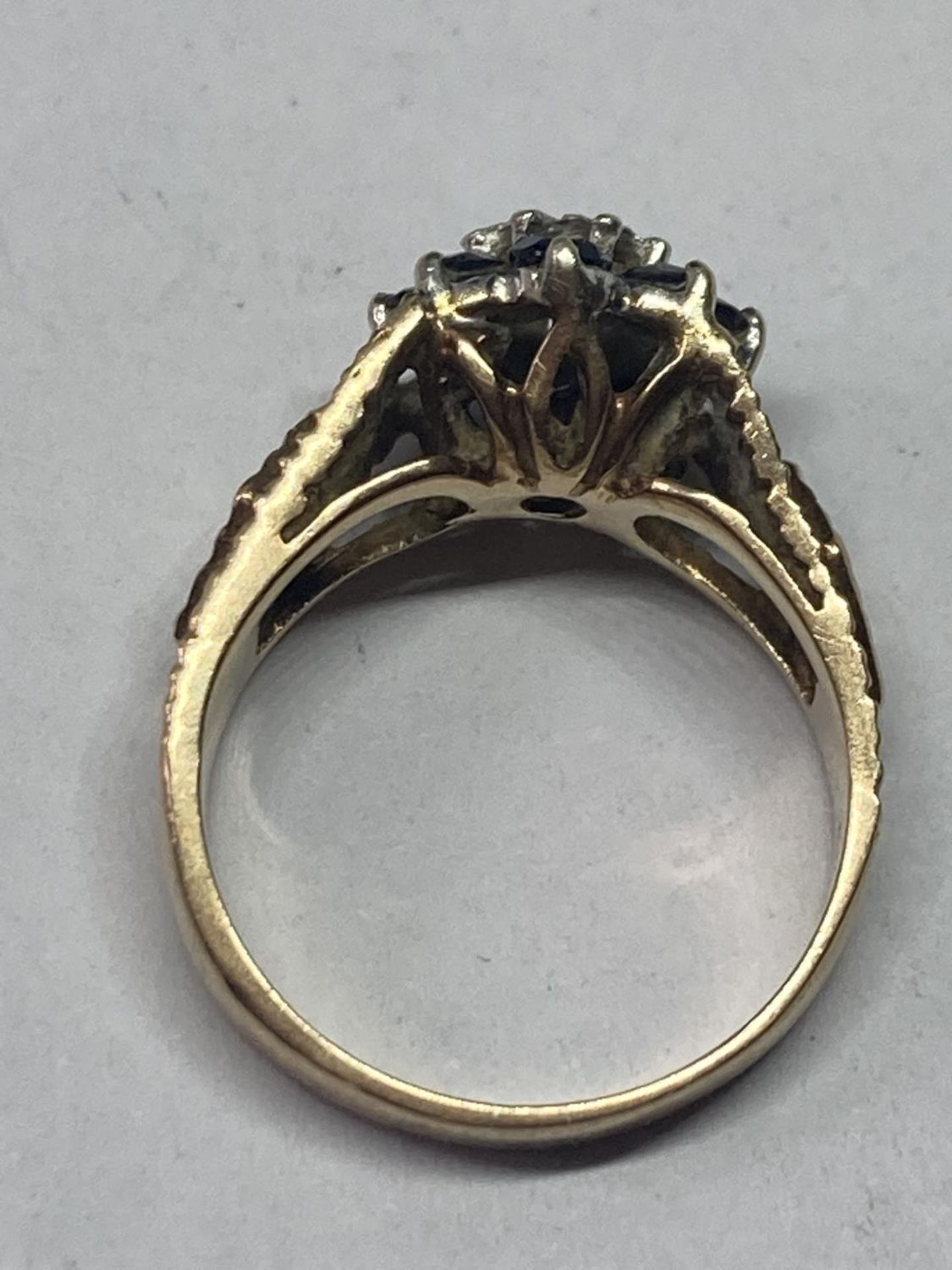 A 9 CARAT GOLD RING WITH CENTRE DIAMOND SURROUNDED BY SAPPHIRES SIZE J - Image 3 of 3