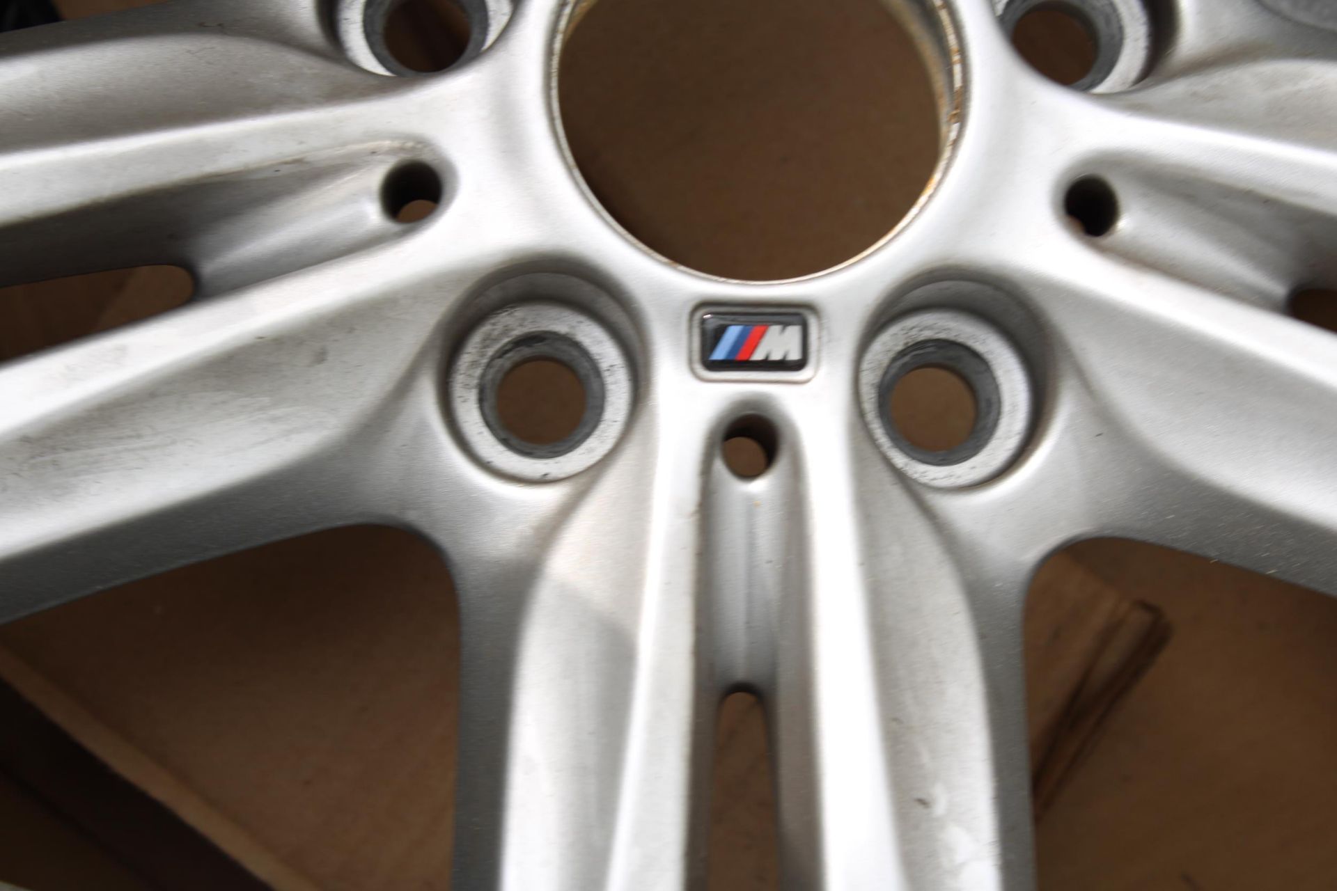 A BMW ALLOY CAR WHEEL AND AN EXHAUST PIPE KIT - Image 3 of 4