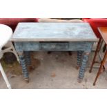 A SHABBY CHIC SIDE TABLE ON TURNED LEGS WITH SINGLE DRAWER 35" WIDE