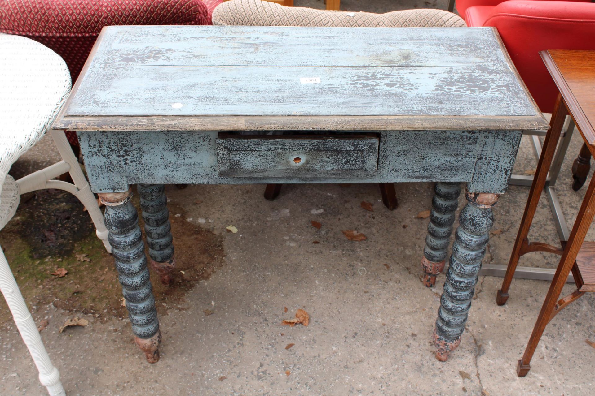 A SHABBY CHIC SIDE TABLE ON TURNED LEGS WITH SINGLE DRAWER 35" WIDE